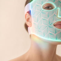 KAVENIS mask glowing during an LED light therapy session